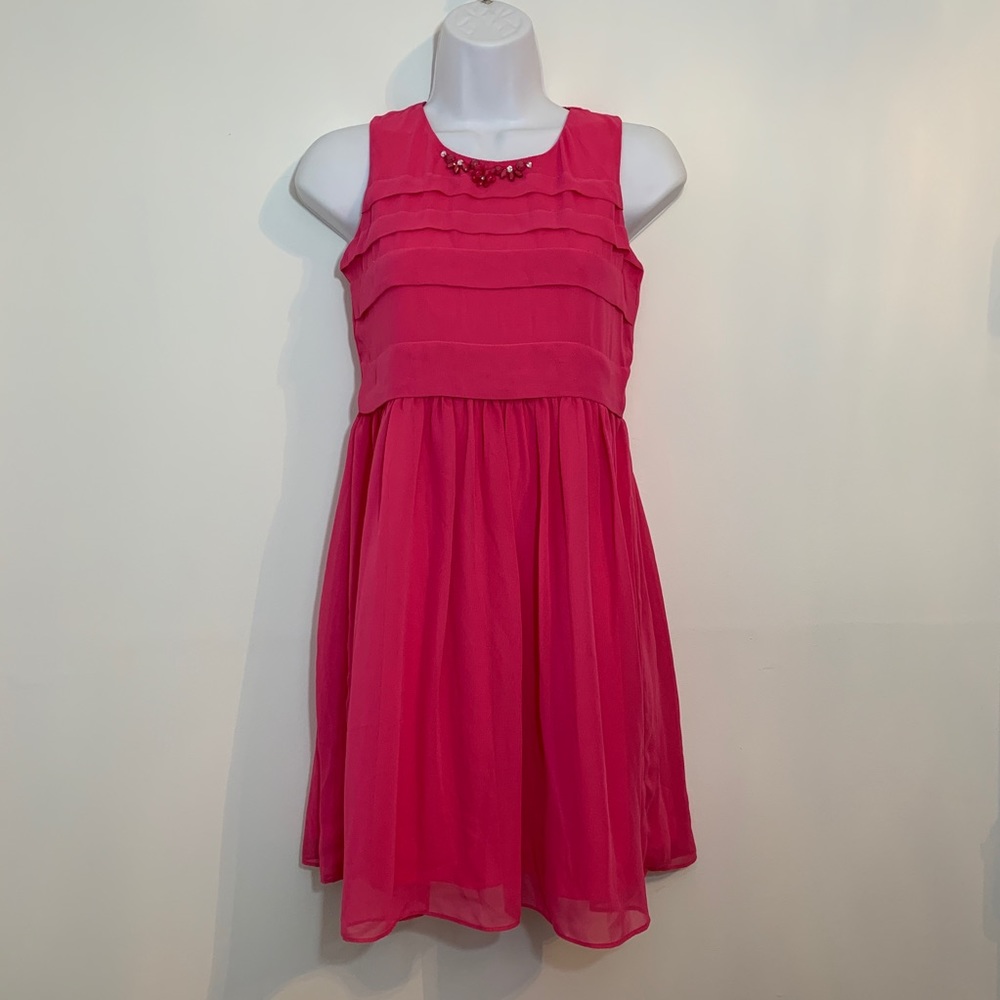 Girls pink dress by Blush is NWT. Size 16